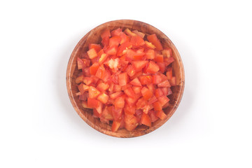Fototapeta na wymiar Chopped Tomatoes in a wooden bowl Top view