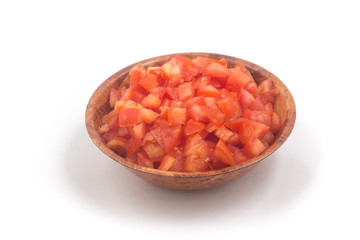 Fototapeta na wymiar Chopped Tomatoes in a wooden bowl