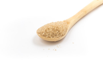 Pile of demerara sugar in a spoon. Top view
