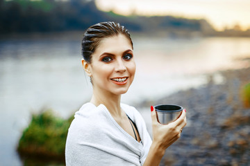 girl drinking tea after bath