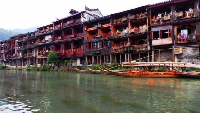 Boat cruise in the old Chinese town of Fenghuang in China
