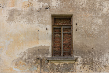 Fototapeta na wymiar Window on old wall