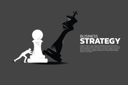 Silhouette of businessman push pawn chess piece to checkmate the king.
