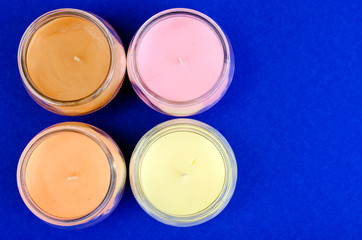 Multicolored aromatic decorative candles in glass