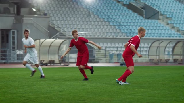 Professional Soccer Players Trying to Dominate the Field