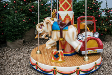 Carousel and Christmas wine drums in Parndorf outlet near Vienna, Austria