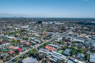 Fototapeta premium Aerial view of urban area with Melbourne CBD in the distance