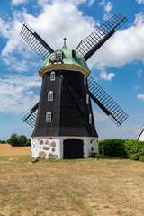 Wheat windmill. Harvest concent. The Stock Photo.