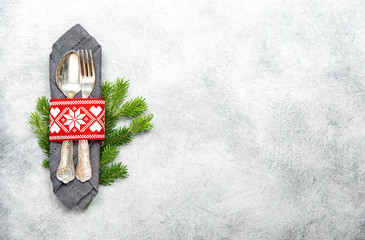 Christmas table decoration pine tree brunches grey background