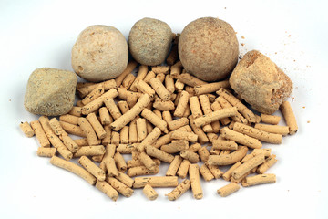 Persian kashk, made from drained sour milk or yoghurt, by forming and letting it dry.