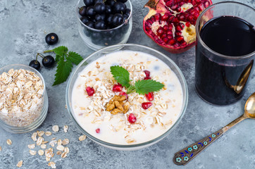 Healthy delicious muesli with oatmeal and pomegranat