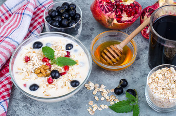 Healthy delicious muesli with oatmeal and pomegranat