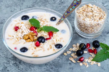 Healthy delicious muesli with oatmeal and pomegranat