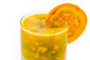 Traditional Colombian beverage made of juice and pieces of lulo (Solanum quitoense) called lulada