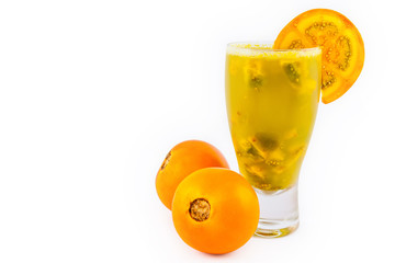 Traditional Colombian beverage made of juice and pieces of lulo (Solanum quitoense) called lulada