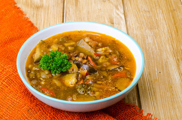 Hot vegetable soup with eggplants and lentils