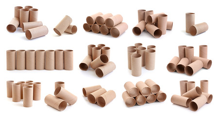 Set with empty paper toilet rolls on white background