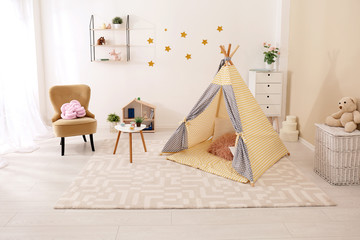 Cozy kids room interior with play tent and toys © New Africa