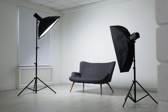 Modern photo studio with professional lighting equipment