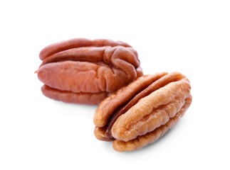 Ripe shelled pecan nuts on white background