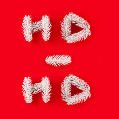 White spruce branches laid out in the form of the phrase 