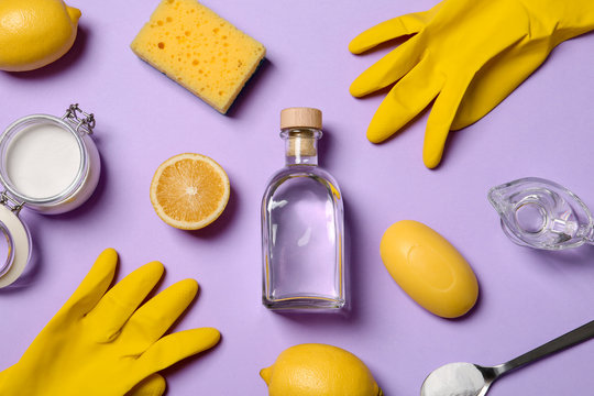 Flat Lay Composition With Vinegar And Cleaning Supplies On Color Background