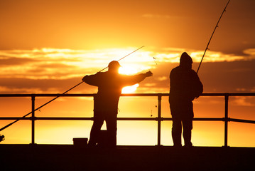 Fishing men at the beach