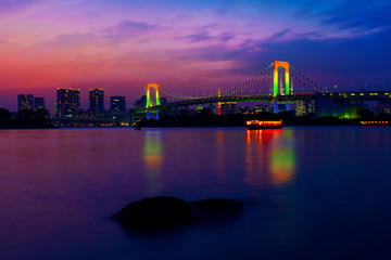 Colorful illuminations at Rainbow Bridge from Odaiba in Tokyo, Japan