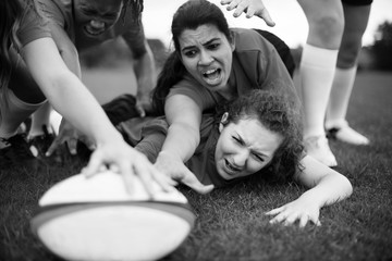 Female rugby players in action