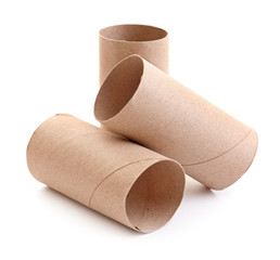 Empty paper toilet rolls on white background