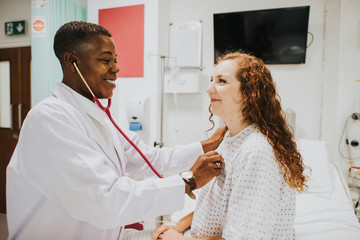 Physician examining a female patient