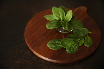 green leaves spinach on a wooden board