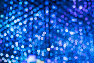 Abstract blue bokeh merge with purple bokeh light background.
