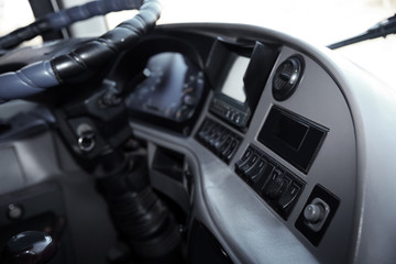 Obraz na płótnie Canvas Professional driver's cab in modern bus, view of dashboard
