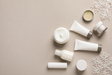 Set of cosmetic products on gray background, flat lay. Winter care
