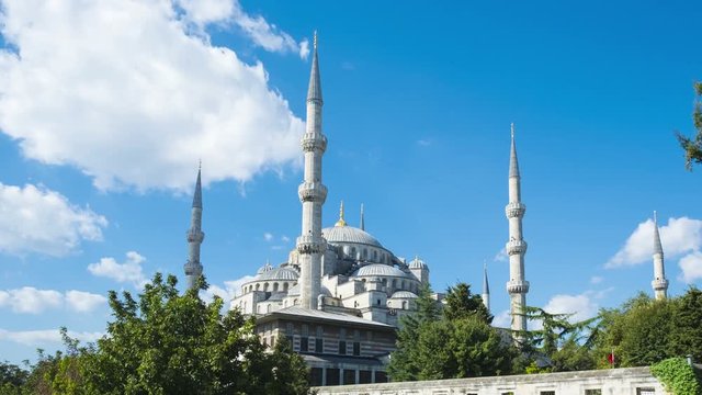 Panning left to right time lapse of the Blue Mosque or Sultan Ahmed Mosque with moving clouds on blue sky day in Istanbul, Turkey. 4k 24fps
