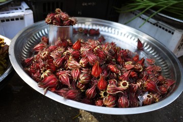 Roselle flower in tray at street food stall in traditional agriculture market - 234203883