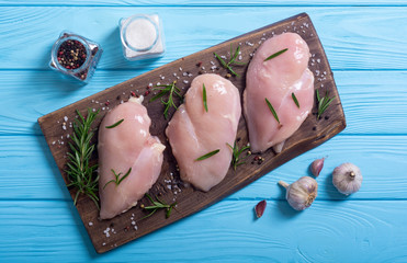 Raw chicken breast ( fillet ) with ingredient