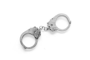 Metal handcuffs on white background top view copy space