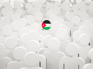 Man with flag of jordan in a crowd