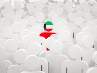 Man with flag of kuwait in a crowd