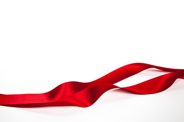 Red ribbon on a white background. Isolated