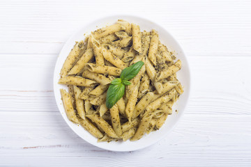 Italian penne pasta with sauce pesto