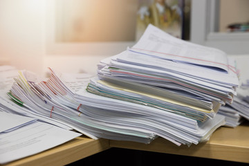 Business and finance concept of office working, Pile of unfinished documents on office desk, Stack of business paper
