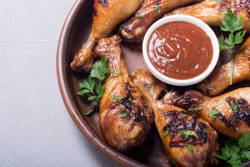 Grilled chicken legs with tomato sauce BBQ food background