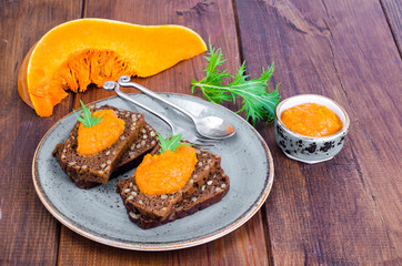 Vegetable caviar from pumpkin and zucchini on wooden table