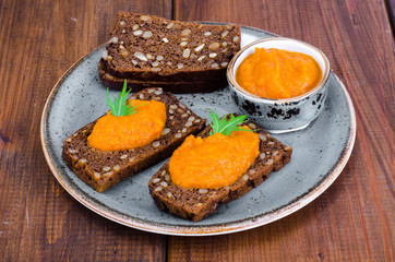 Vegetable caviar from pumpkin and zucchini on wooden table
