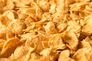Background texture of cornflakes. Selective focus