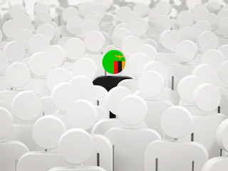 Obraz premium Man with flag of zambia in a crowd