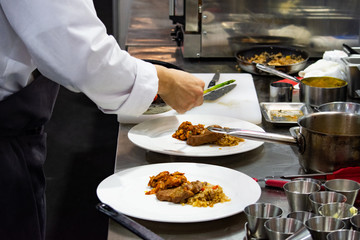 Chef preparing food, meal, in the kitchen, chef cooking, Chef decorating dish, closeup, .Chef preparing food, meal, in the kitchen, chef cooking, Chef decorating dish, closeup, .